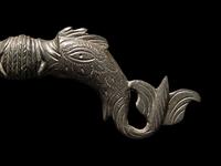 A Roman Bronze Double-Dolphin Handle