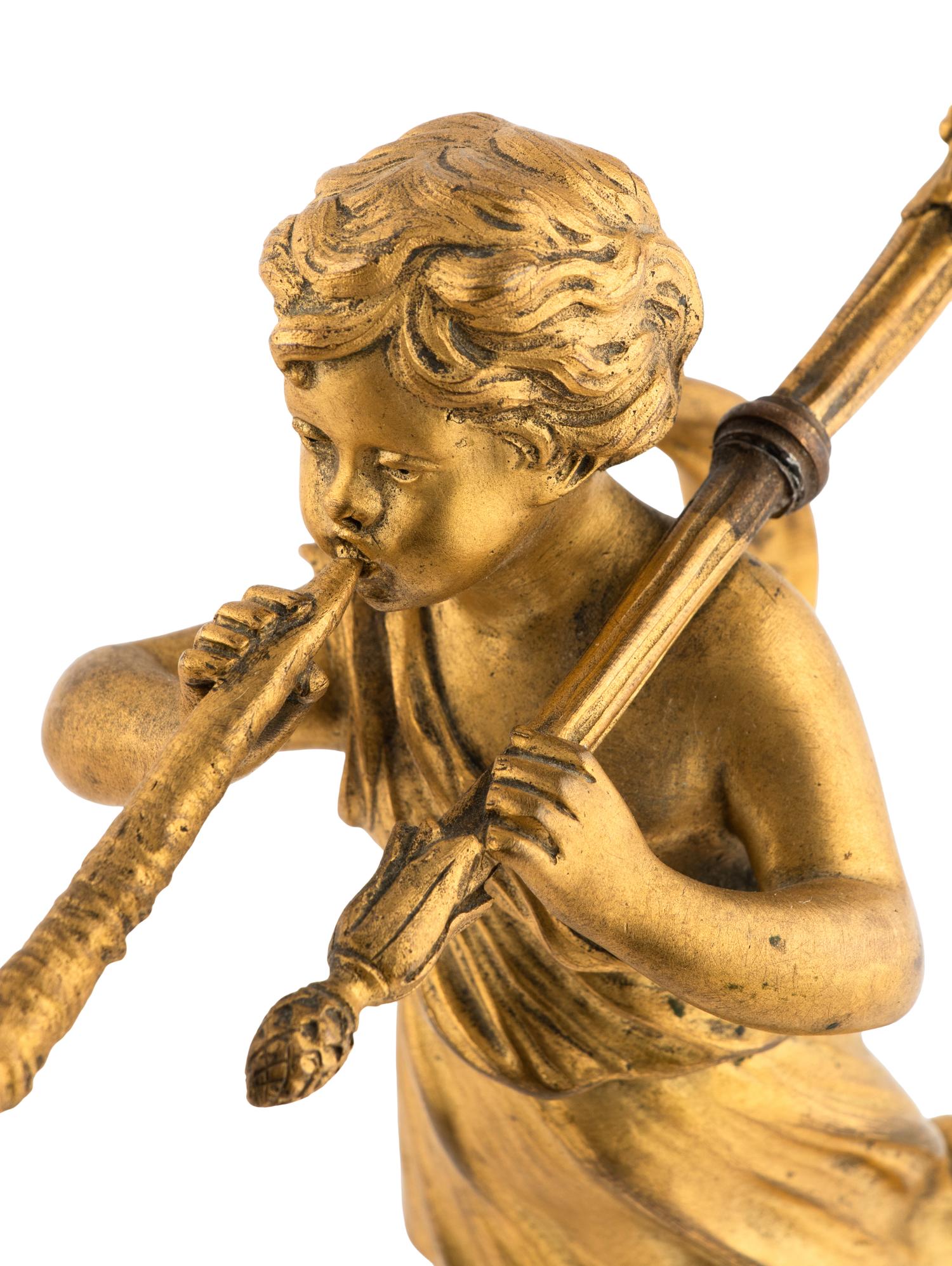 A Pair of French Gilt Bronze Figural Two-Light Candelabra