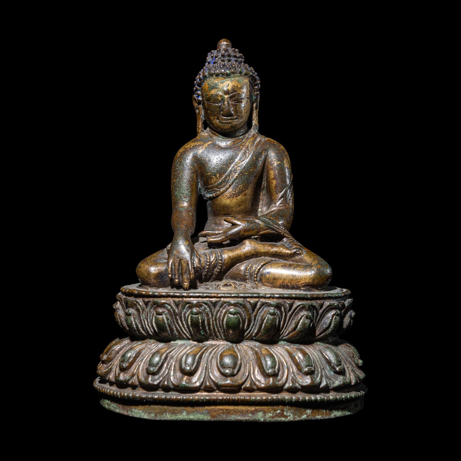 A Tibetan Gilt Copper Alloy Figure of Buddha Shakyamuni, 14th/15th Century 十四/十五世紀 西藏銅鎏金坐佛