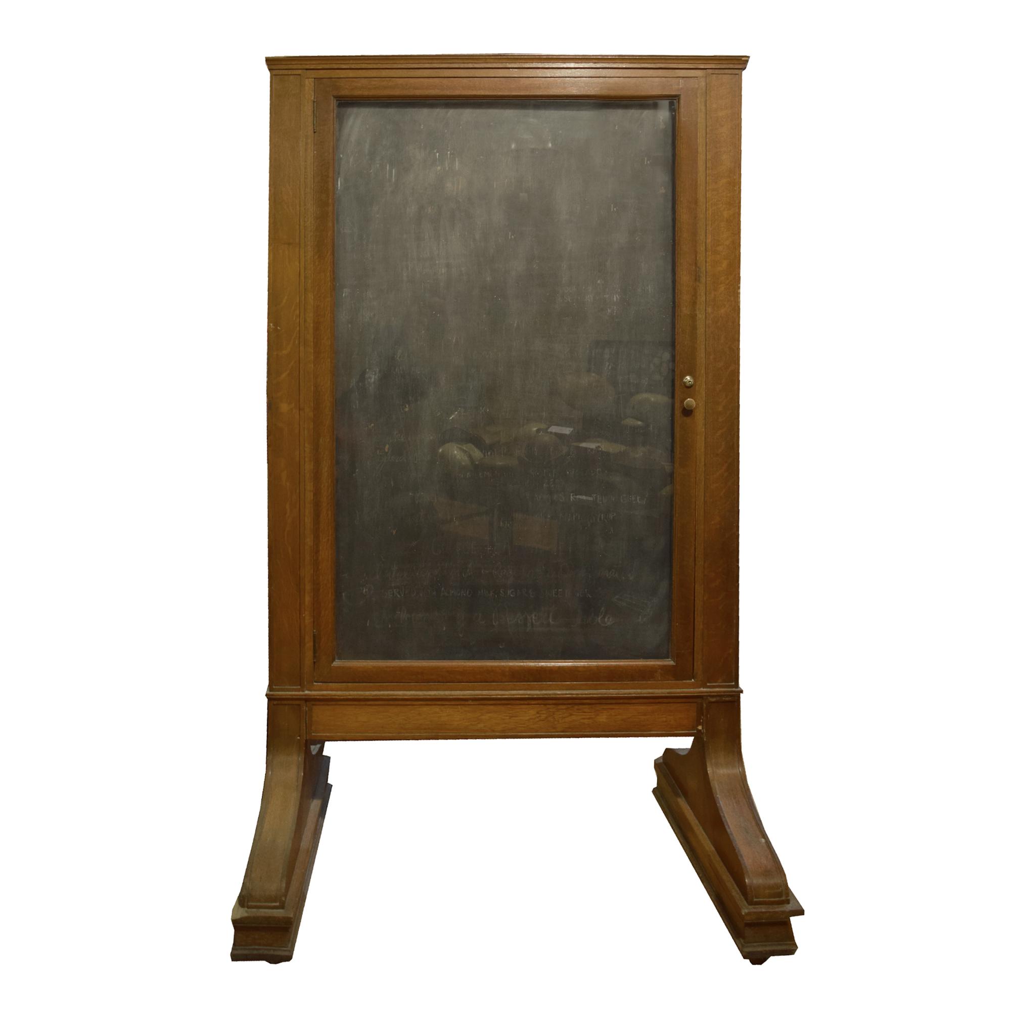 An Oak and Glass Display Board from Chicago's Union Station 47" W x 31" D x 81" H — United States, 20th Century