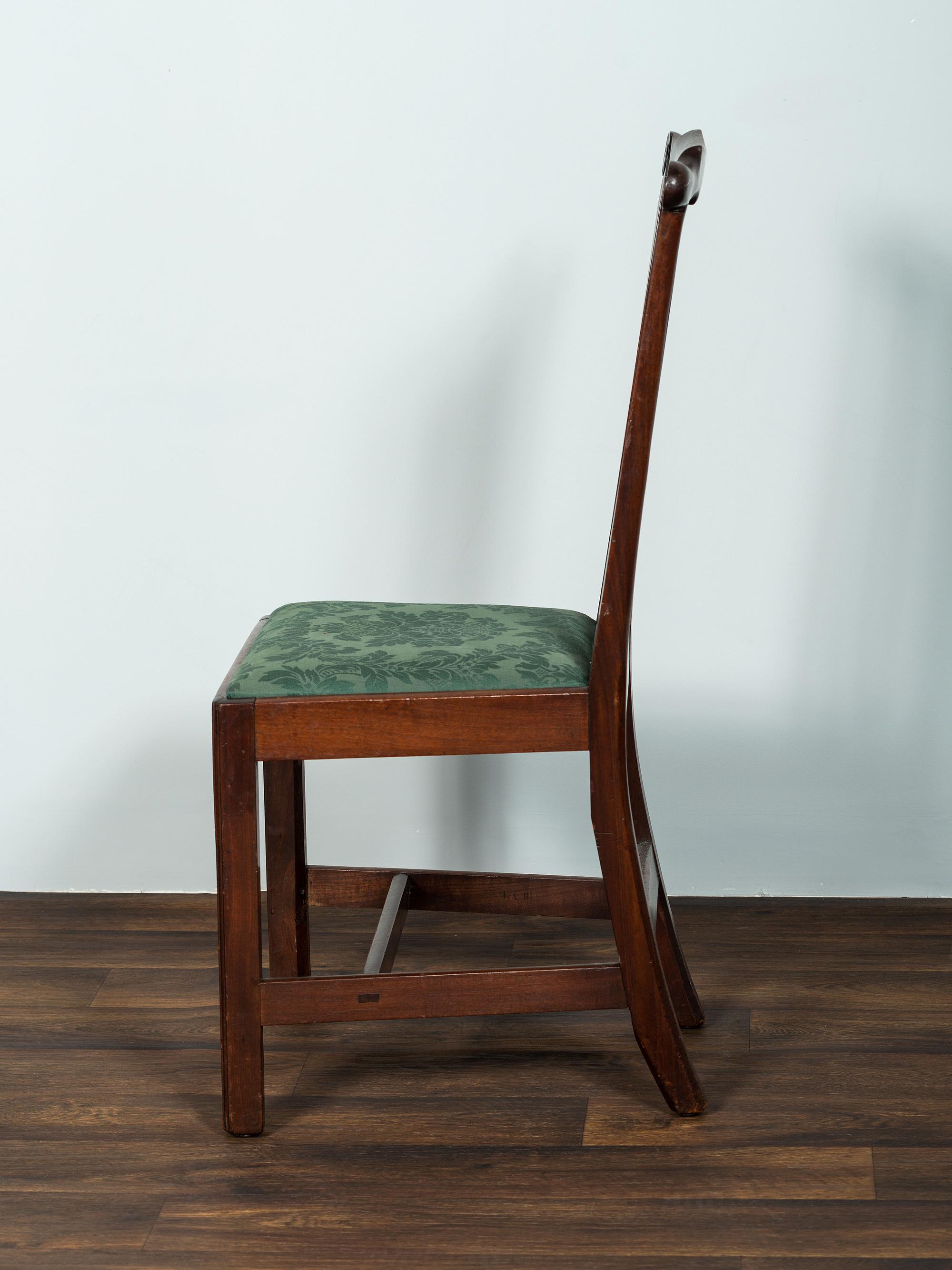 A Set of Six Chippendale Volute-Carved Mahogany Side Chairs