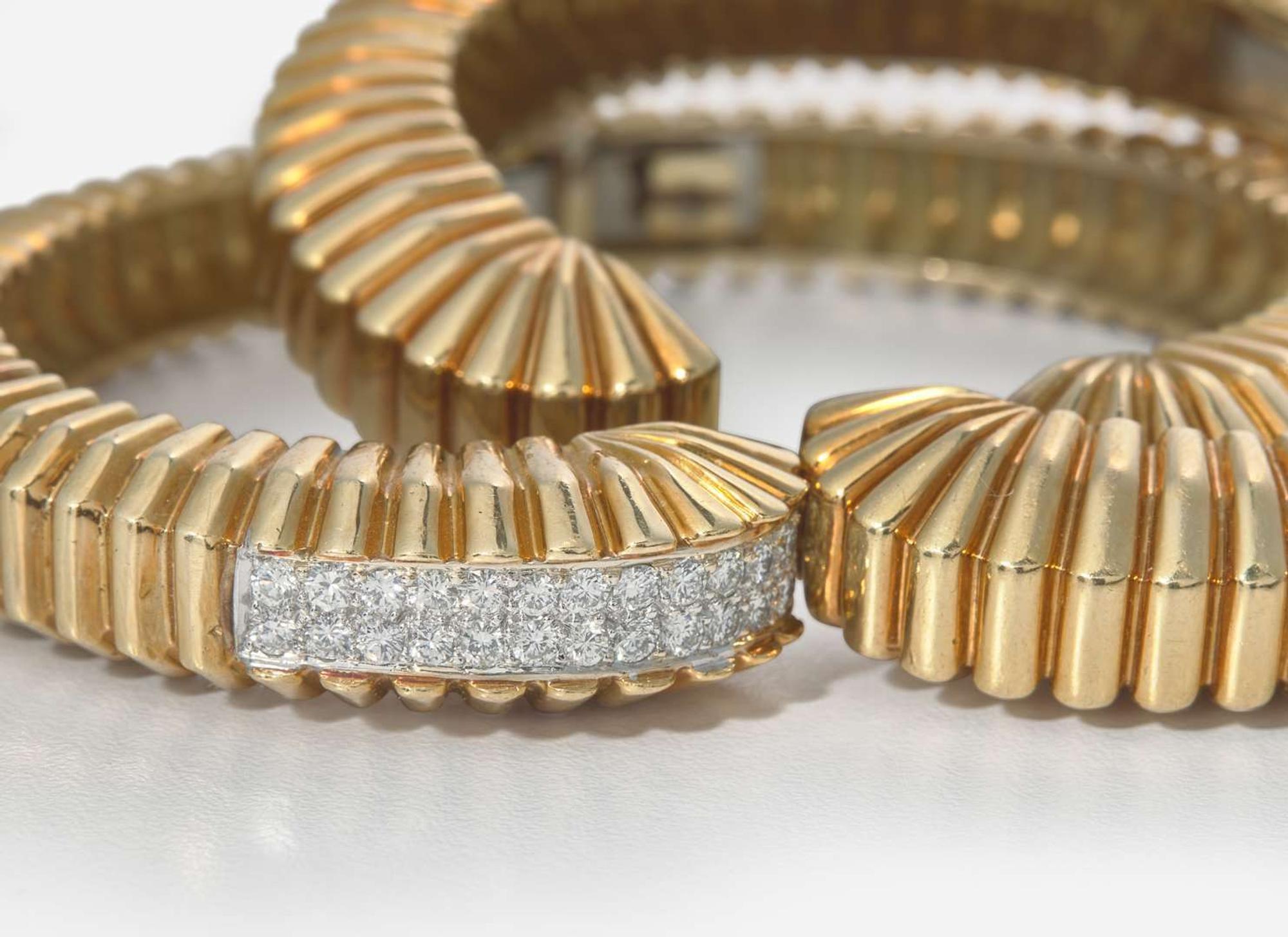 A Pair of Matching 18K Yellow Gold Bangle Bracelets with Diamonds