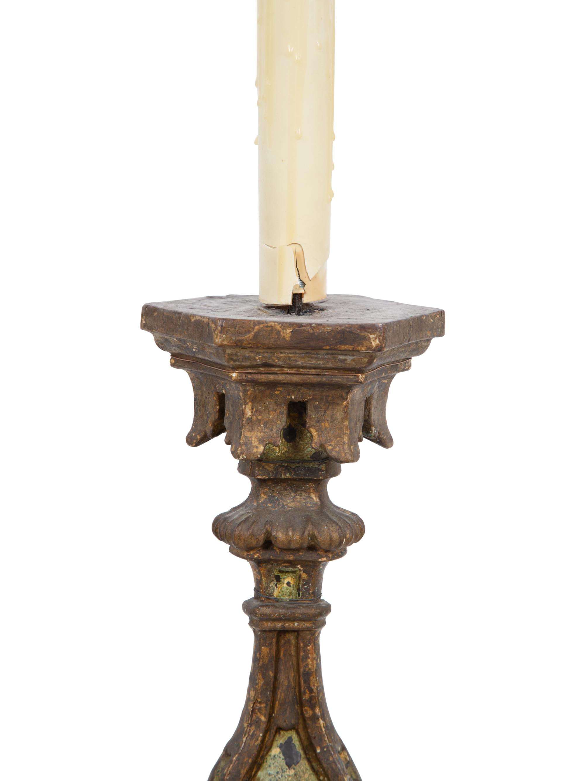A Pair of Italian Painted and Parcel Gilt Pricket Candlesticks