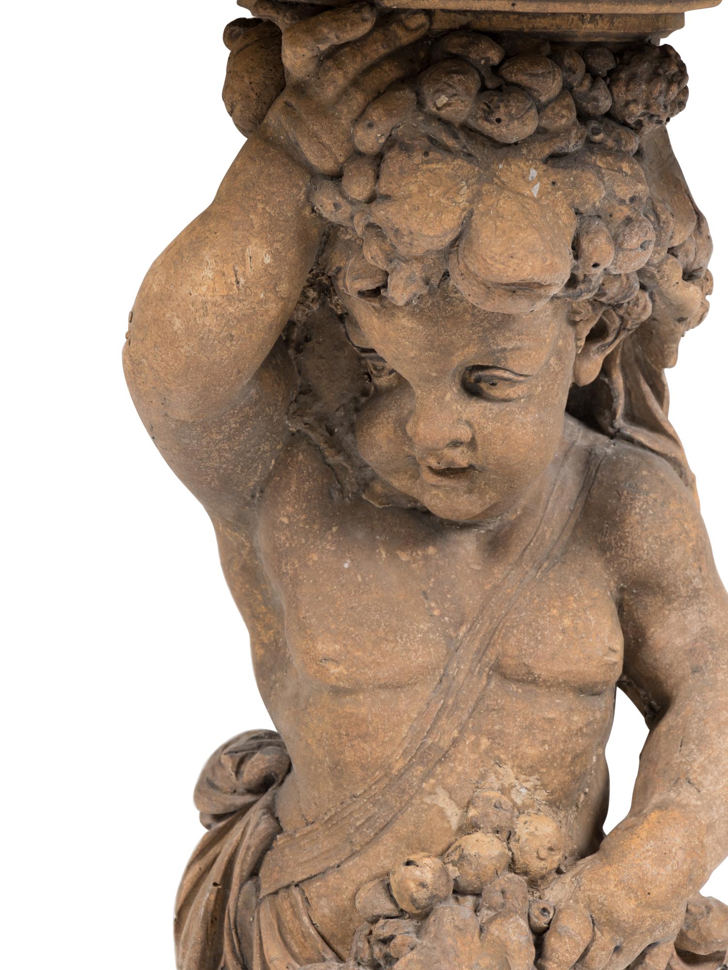 A Pair of French Cast Stone Consoles d'Appliqué with Stone Tops