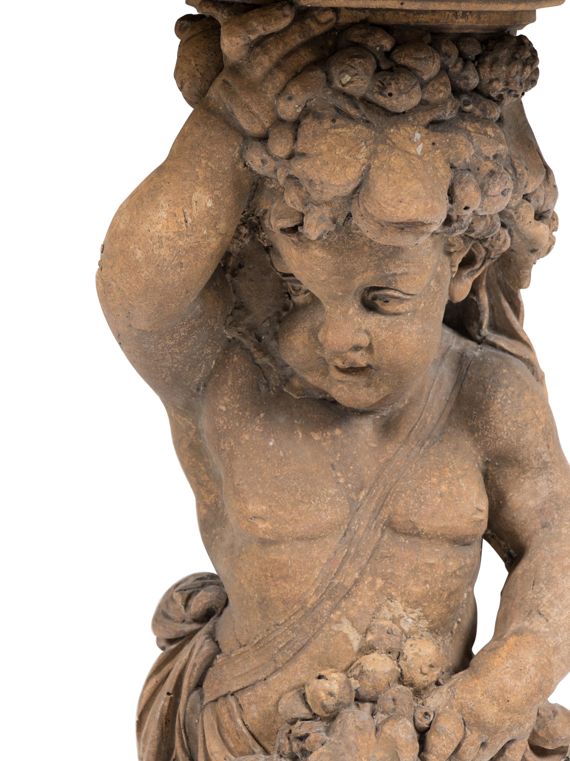 A Pair of French Cast Stone Consoles d'Appliqué with Stone Tops