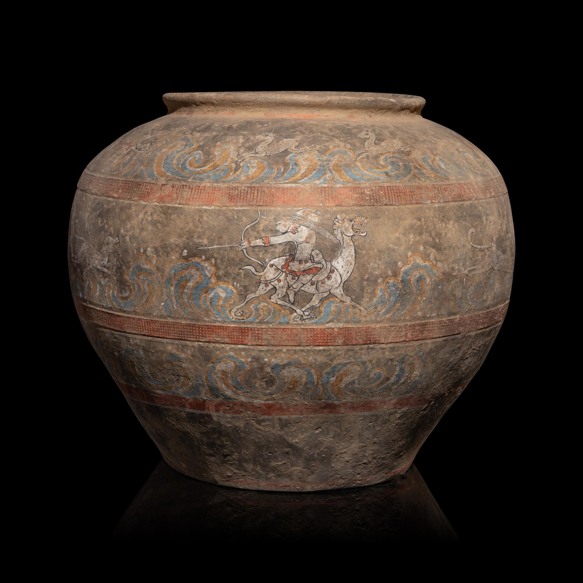 A Chinese Painted Pottery 'Mythical Beast' Jar, Han Dynasty — 漢 灰陶彩繪狩獵圖大罐