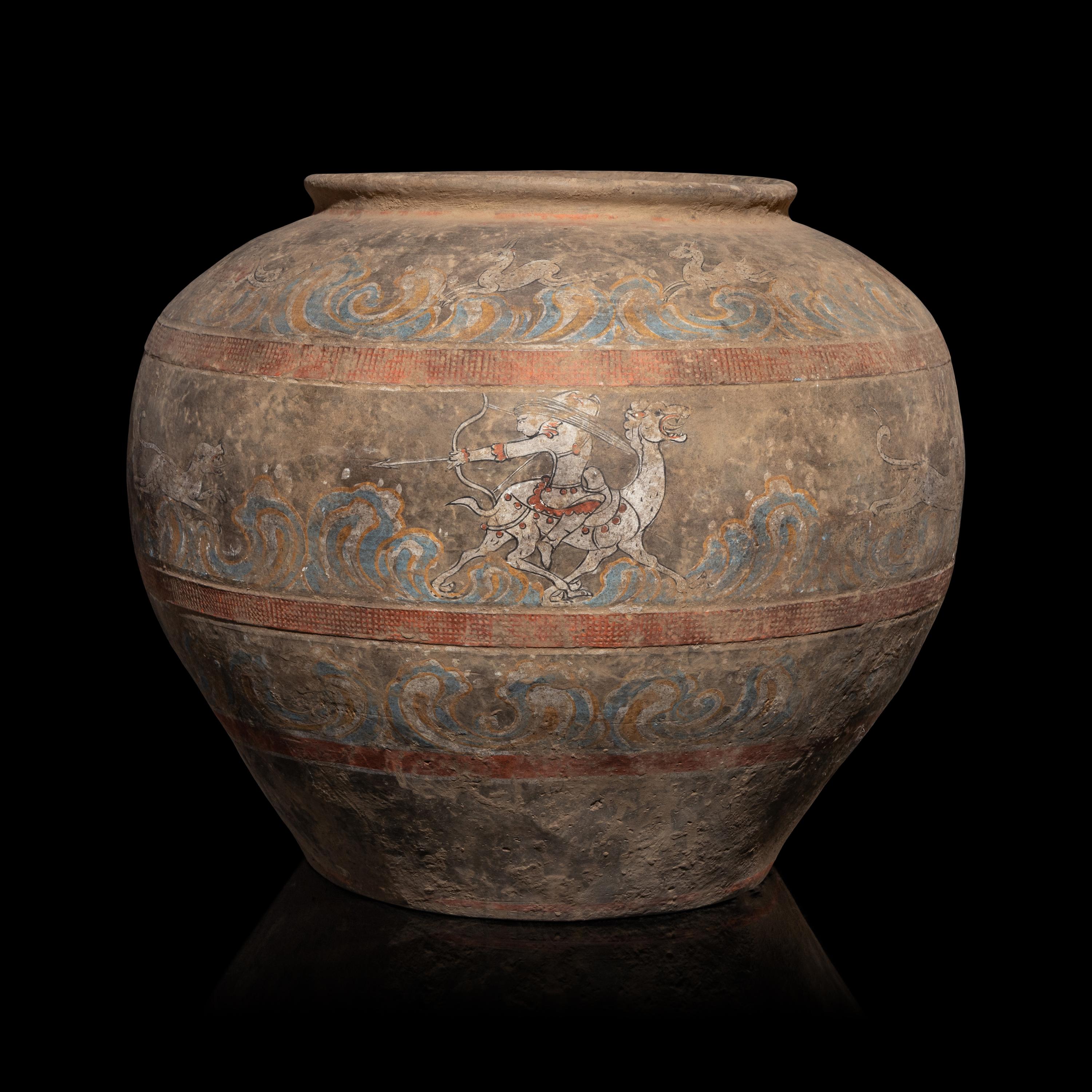 A Chinese Painted Pottery 'Mythical Beast' Jar, Han Dynasty — 漢 灰陶彩繪狩獵圖大罐