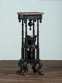 A Victorian Marble-Top Carved and Ebonized Parlor Table with Dog