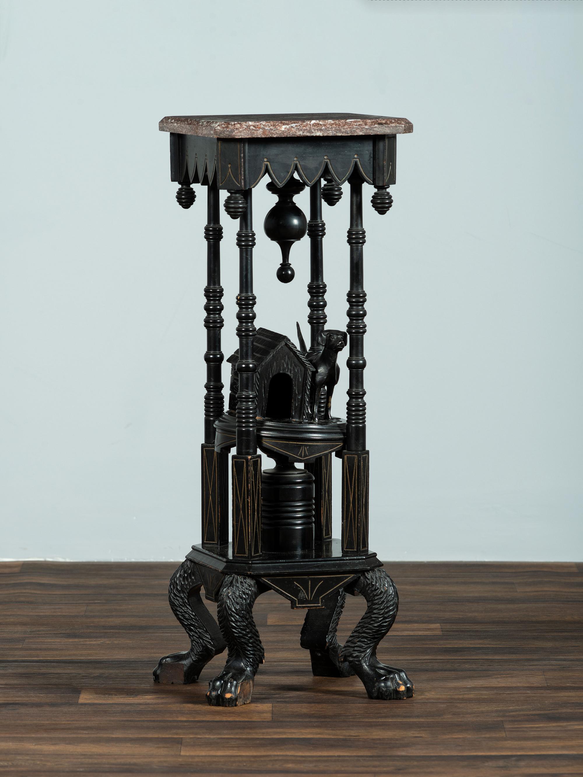 A Victorian Marble-Top Carved and Ebonized Parlor Table with Dog