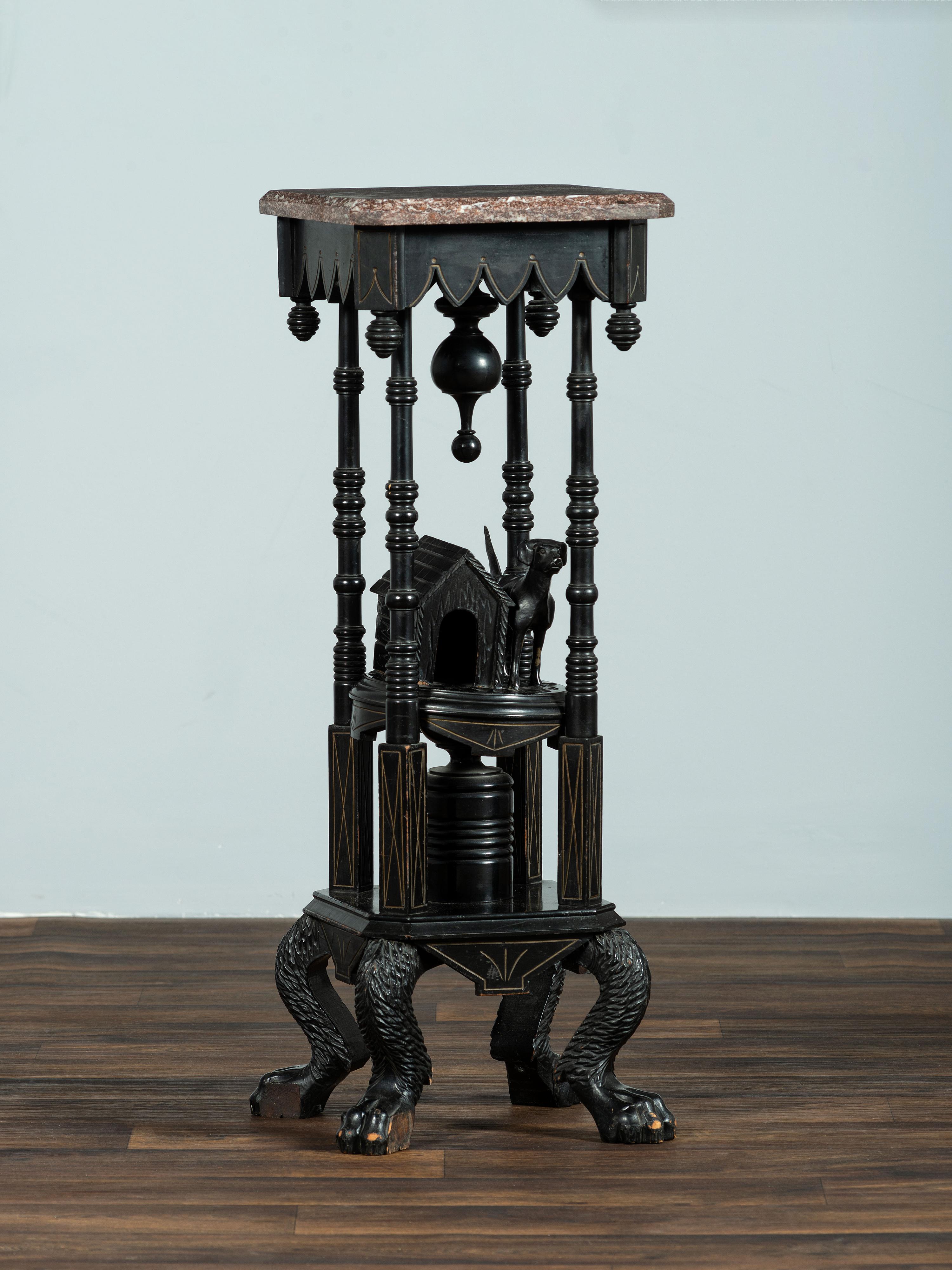 A Victorian Marble-Top Carved and Ebonized Parlor Table with Dog