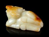 A Russet and White Jade Figure of a Buffalo