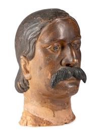 A Carved and Painted Wood Head of a Mustachioed Man