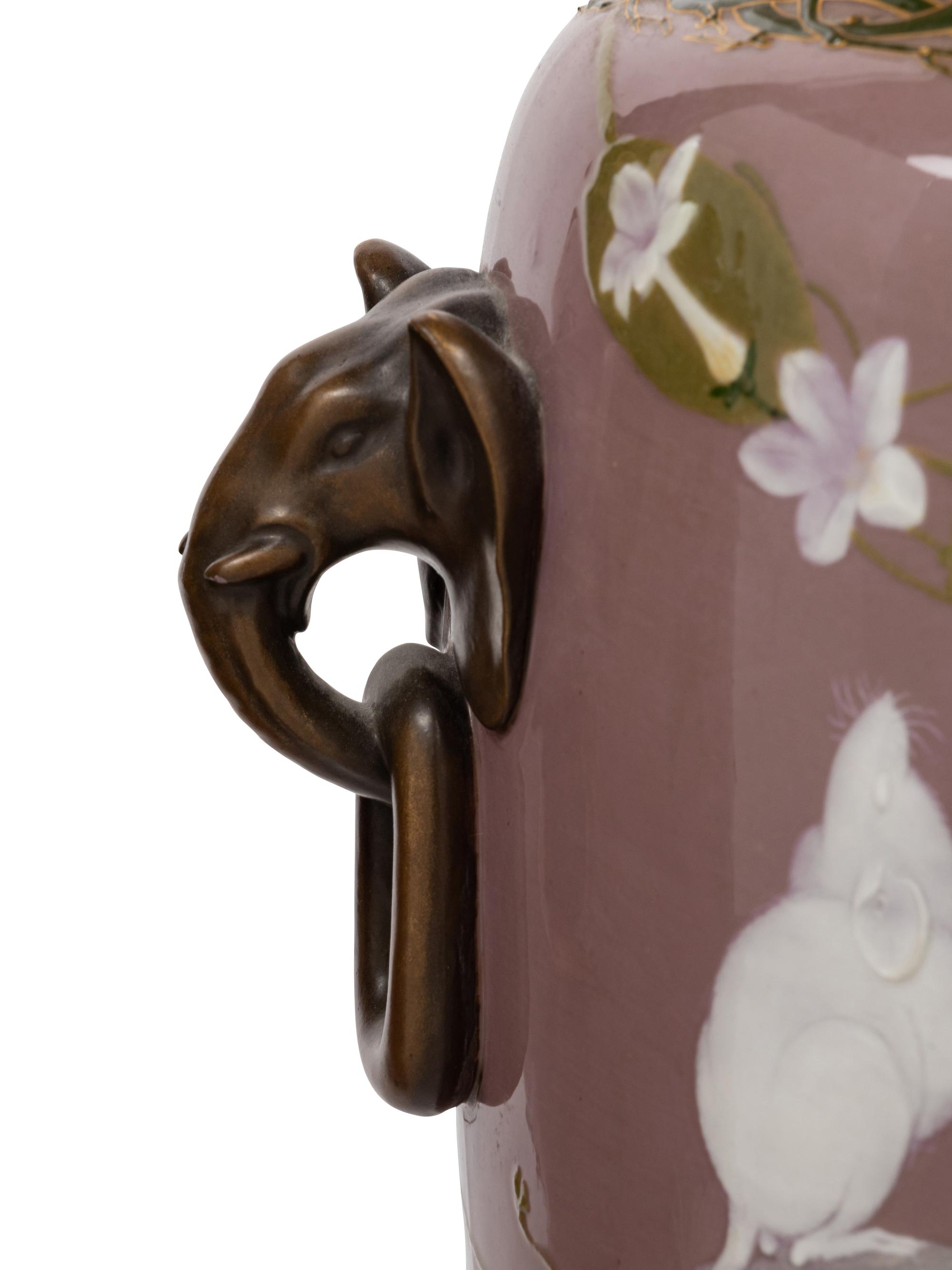 A Pair of Mintons Pate-sur-Pate Elephant Handle Urns