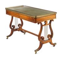 A Regency Brass Mounted Rosewood and Rosewood Grained Writing Table