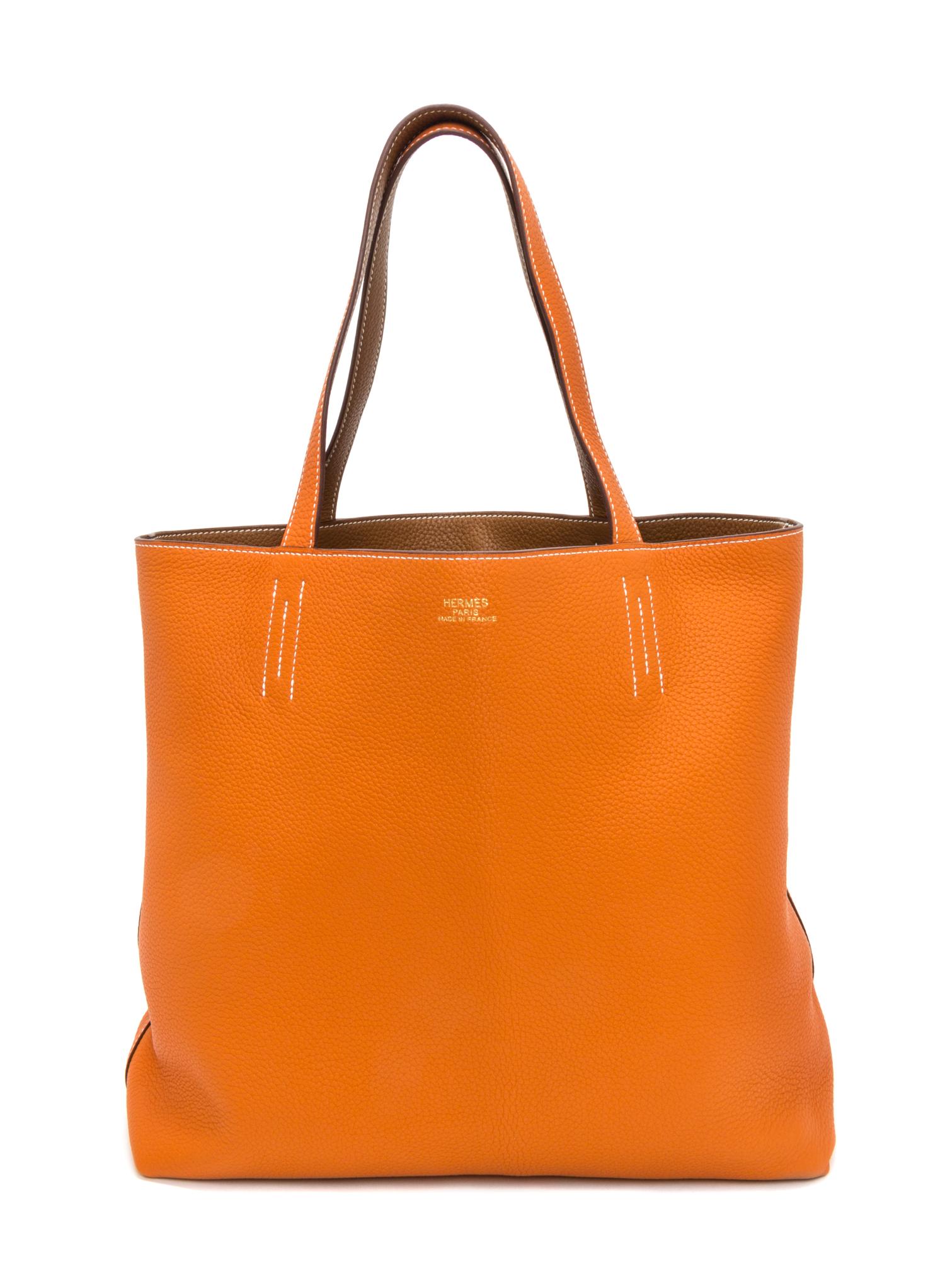 An Hermes Orange/Gold 45cm Taurillon Clemence Double Sens Tote, 17.5" x 15.5" x 5".
