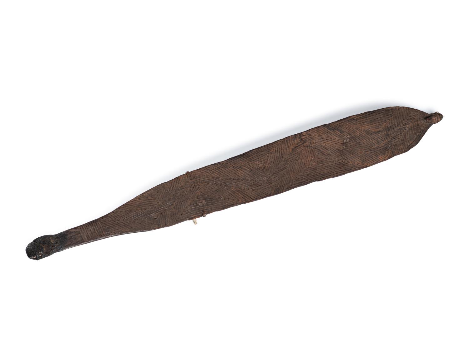 An Aboriginal Wood Spear Thrower (woomera)