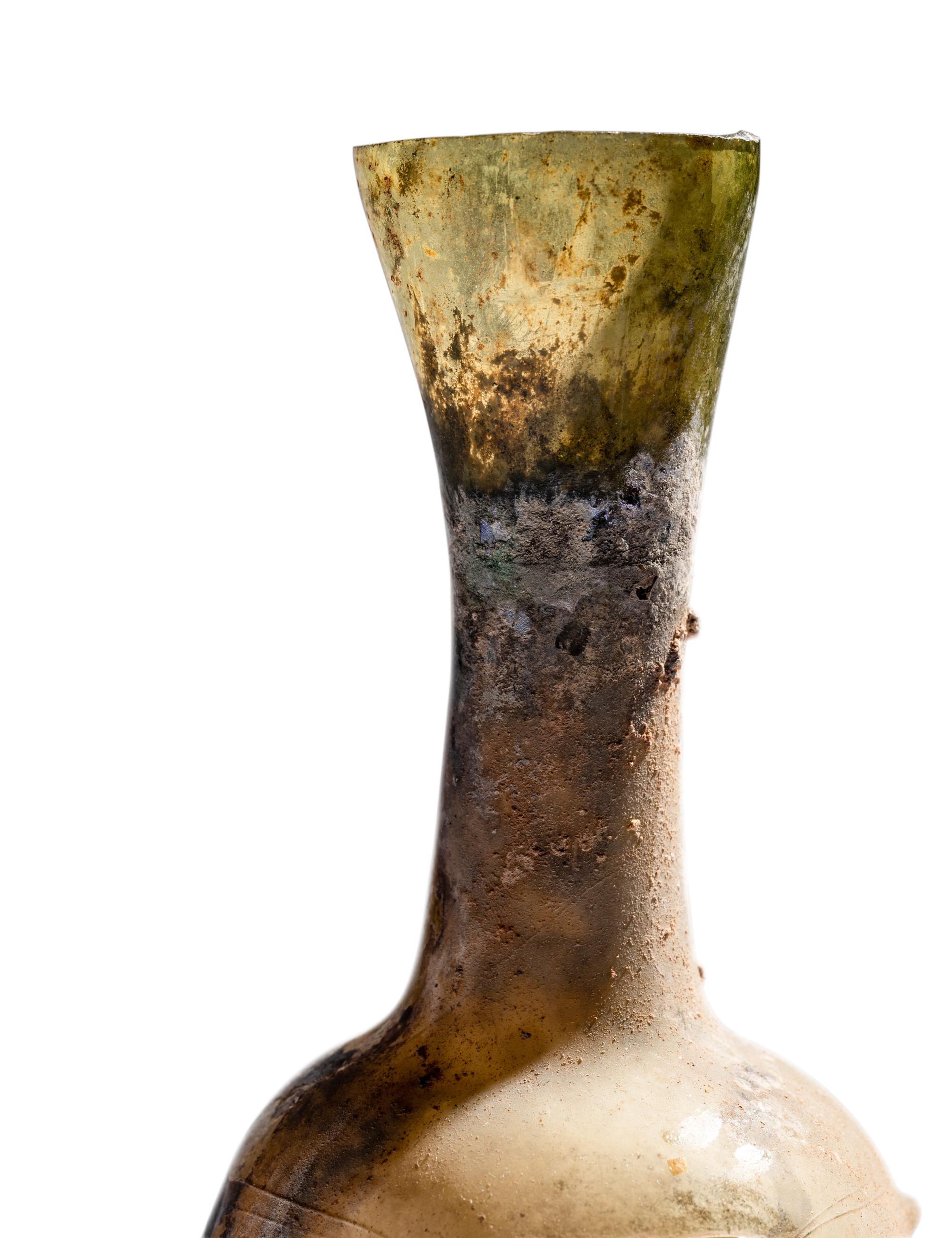 A Roman Glass Unguentarium with Six Knobs