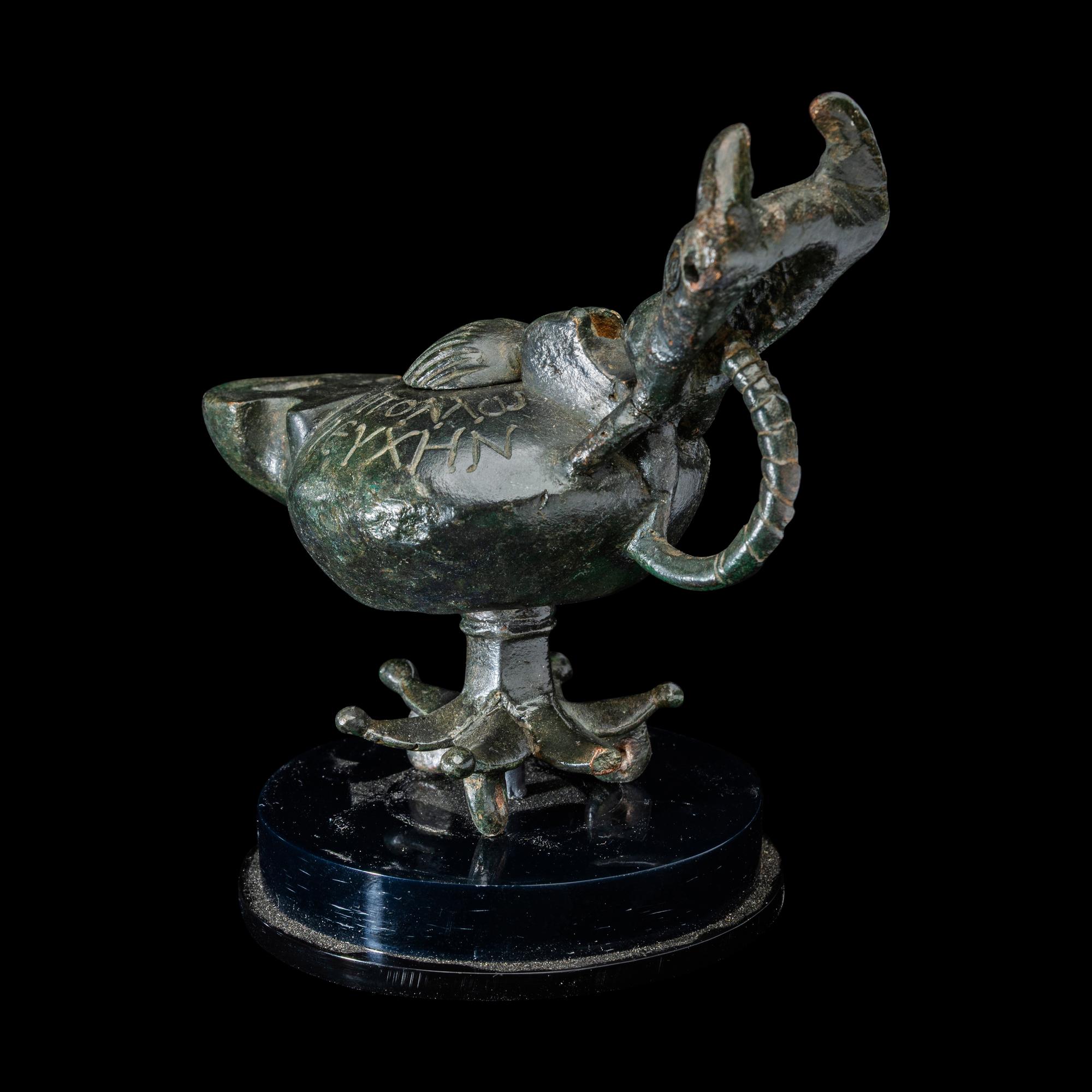 A Late Roman Bronze Lamp with Bull Head Handle and Greek Inscription