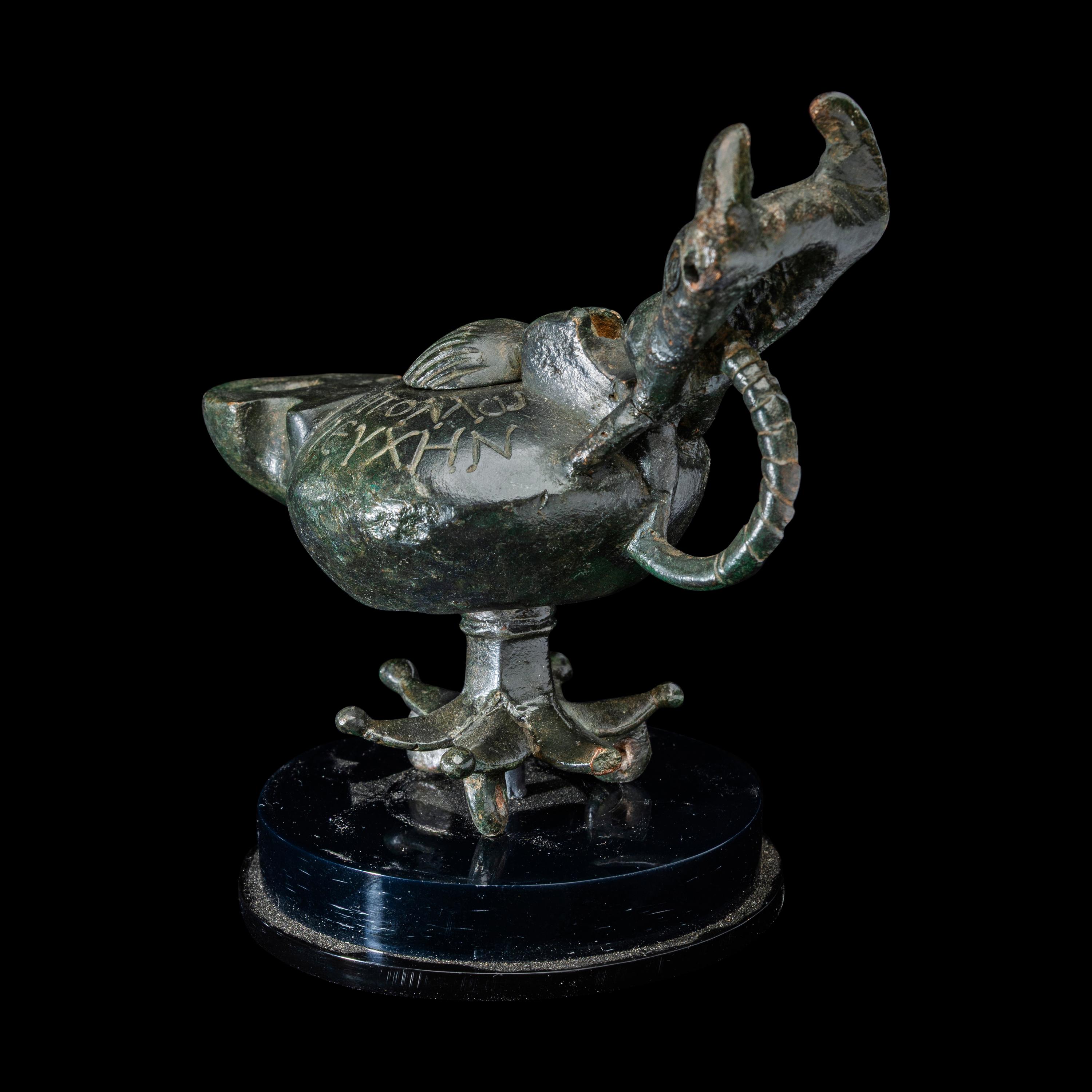 A Late Roman Bronze Lamp with Bull Head Handle and Greek Inscription