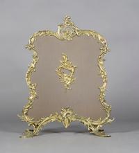 A Louis XV Style Gilt Metal Firescreen, Height 32 1/4 inches.