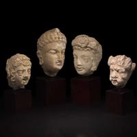 A group of four small stucco heads 石灰岩佛首一组四件 Gandhara, 4rd-5th Century ??? ?????