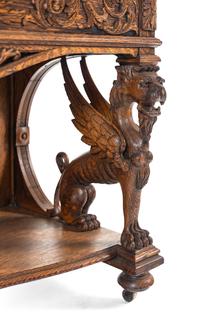 A Renaissance Revival Carved Oak Slant-Front Bureau