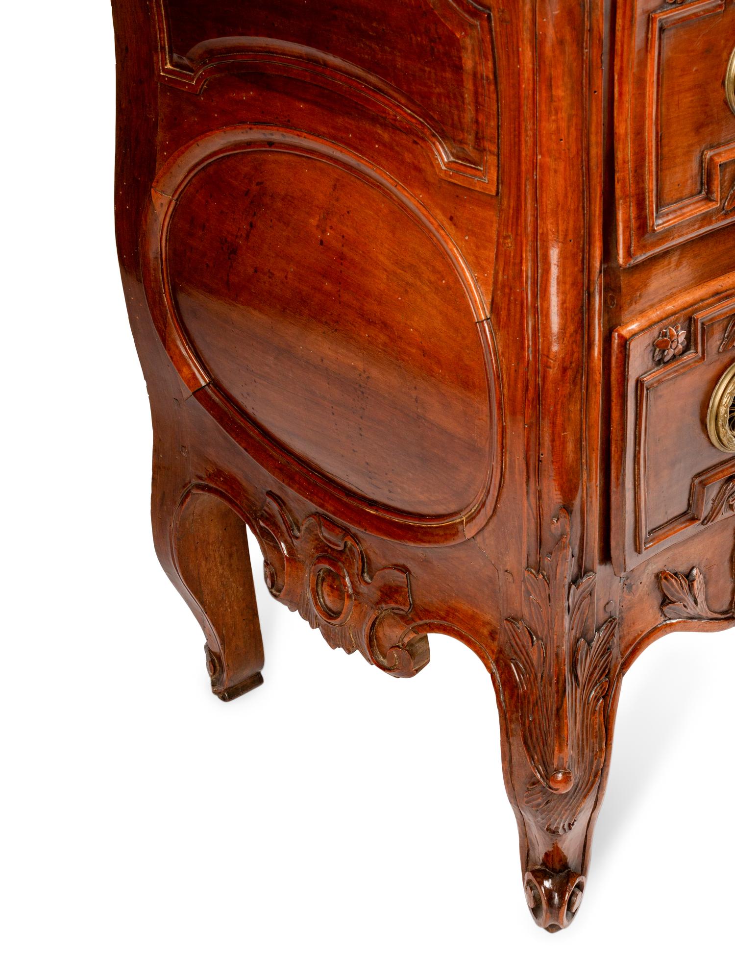 A Louis XV Provincial Carved Walnut Commode — LATE 18TH CENTURY