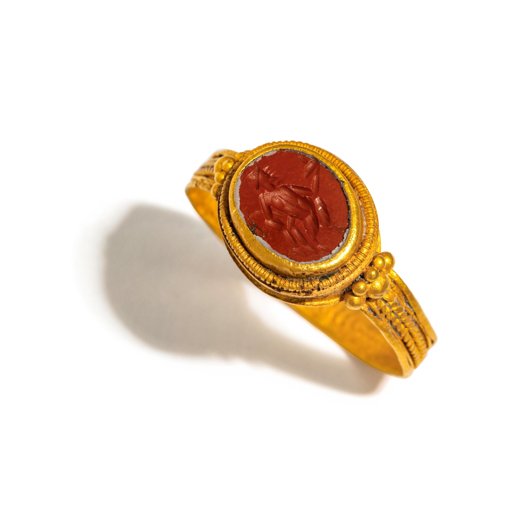 A Roman Gold and Jasper Finger Ring with a Dancing Satyr