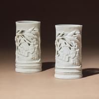 A Pair of Chinese Blanc-de-Chine Reticulated Porcelain 'Scholars' Brush Pots, Bitong, 17th-18th Century — 清早期 德化白瓷鏤雕竹林七賢筆筒一對
