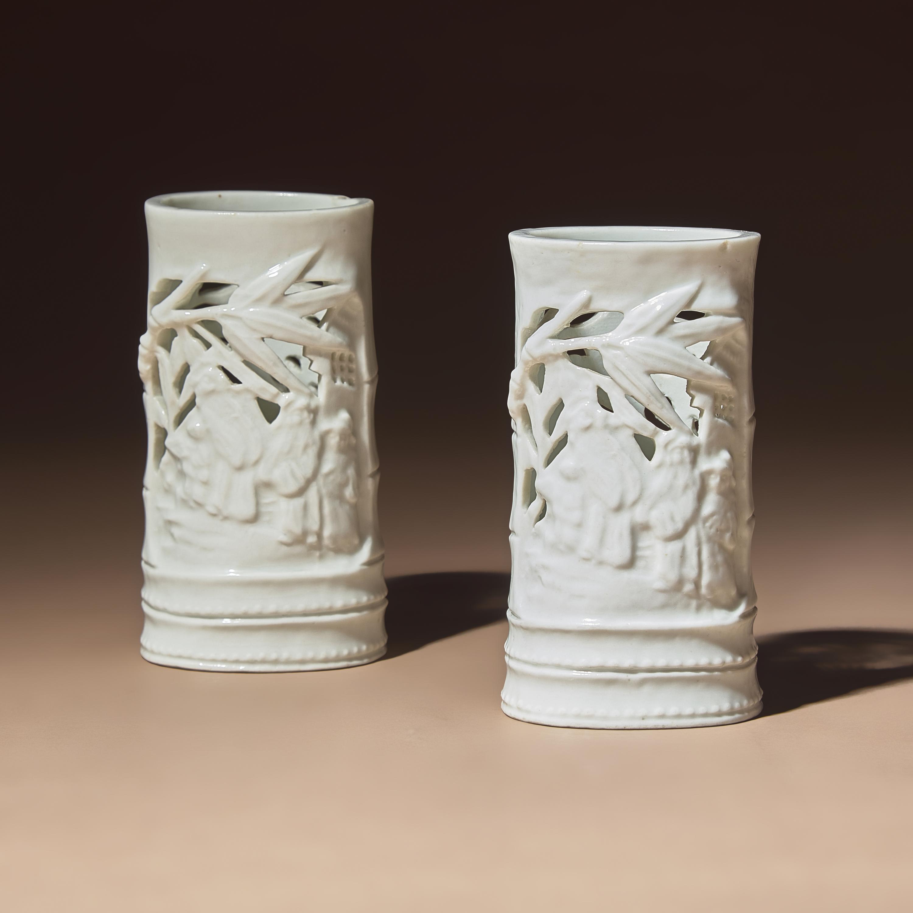 A Pair of Chinese Blanc-de-Chine Reticulated Porcelain 'Scholars' Brush Pots, Bitong, 17th-18th Century — 清早期 德化白瓷鏤雕竹林七賢筆筒一對