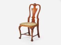 A Queen Anne carved walnut balloon seat side chair, Ireland, circa 1725