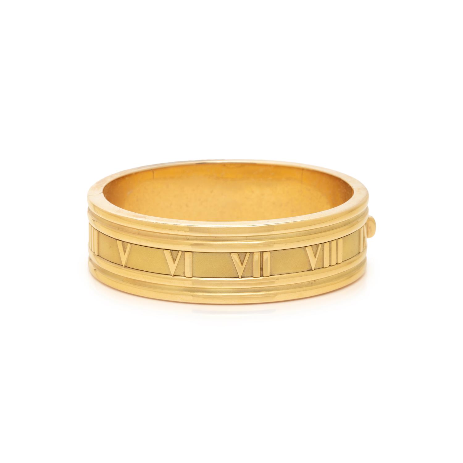 TIFFANY & CO., YELLOW GOLD 'ATLAS' BANGLE BRACELET