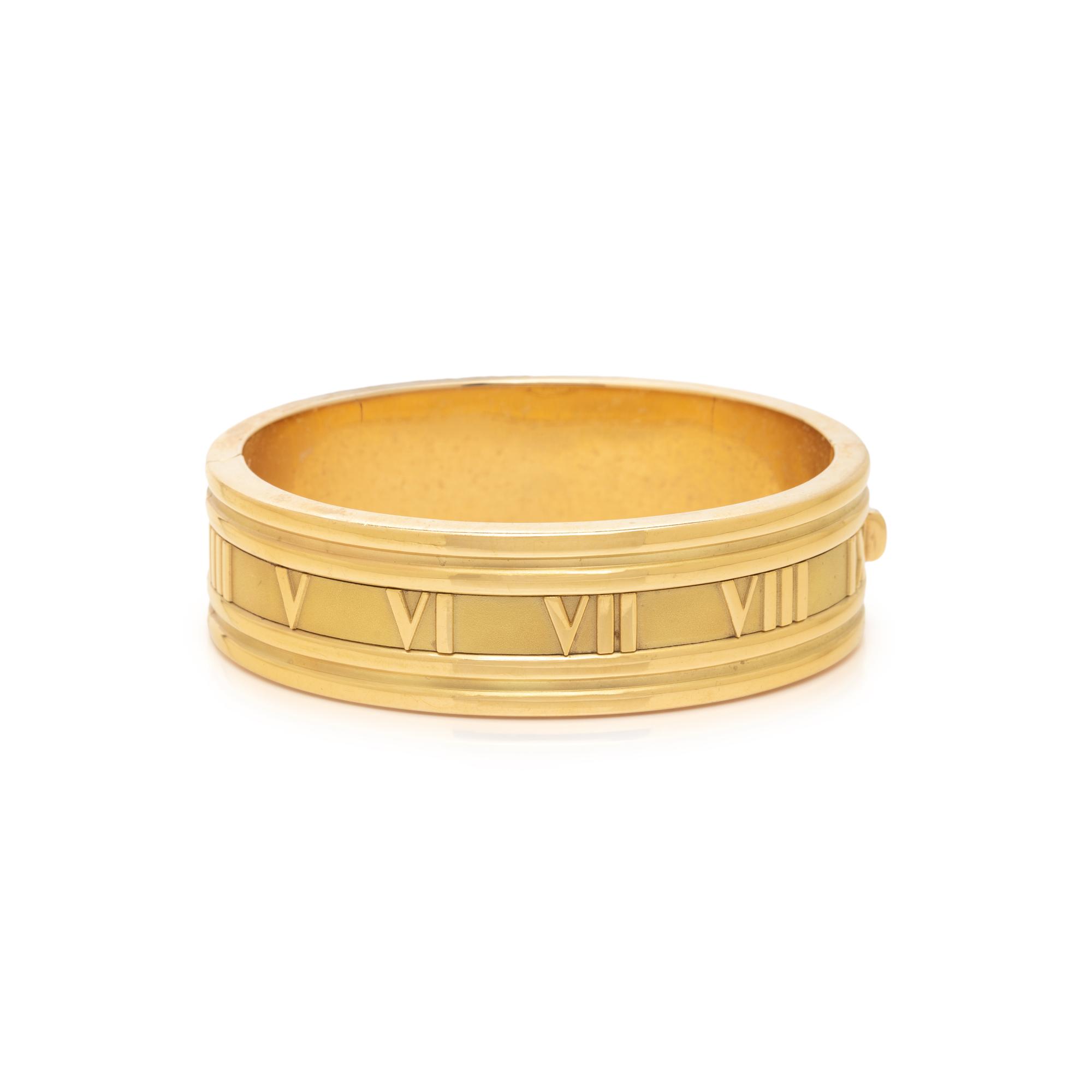 TIFFANY & CO., YELLOW GOLD 'ATLAS' BANGLE BRACELET
