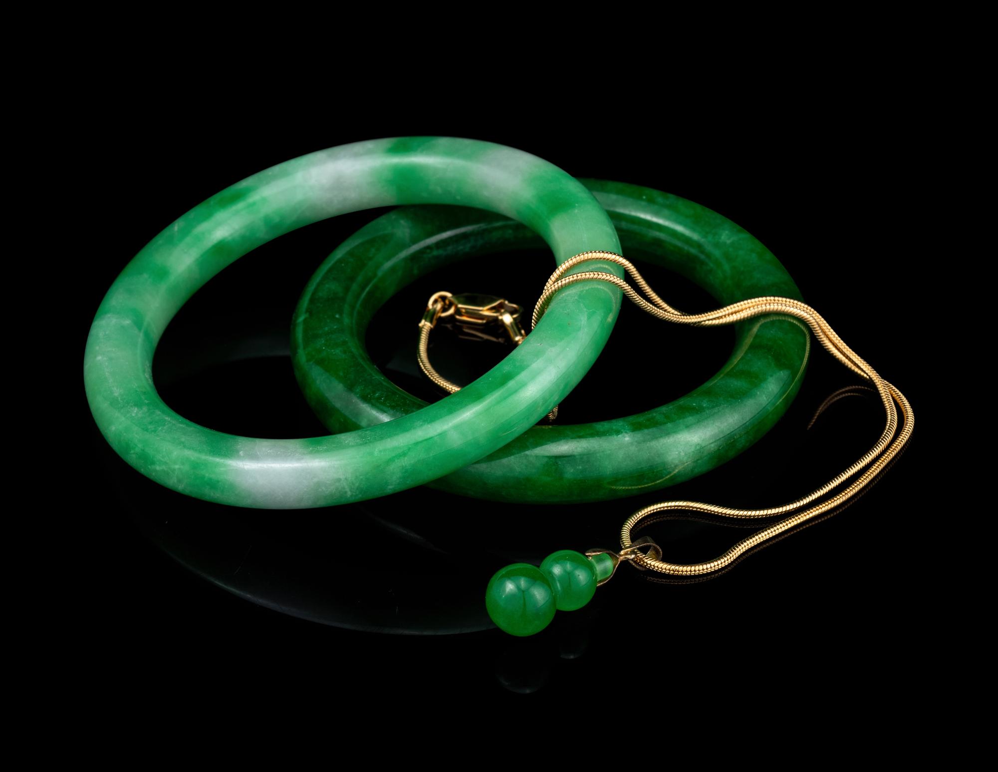 Two Chinese Jadeite Bangles and A Jadeite Gourd-Form Pendant