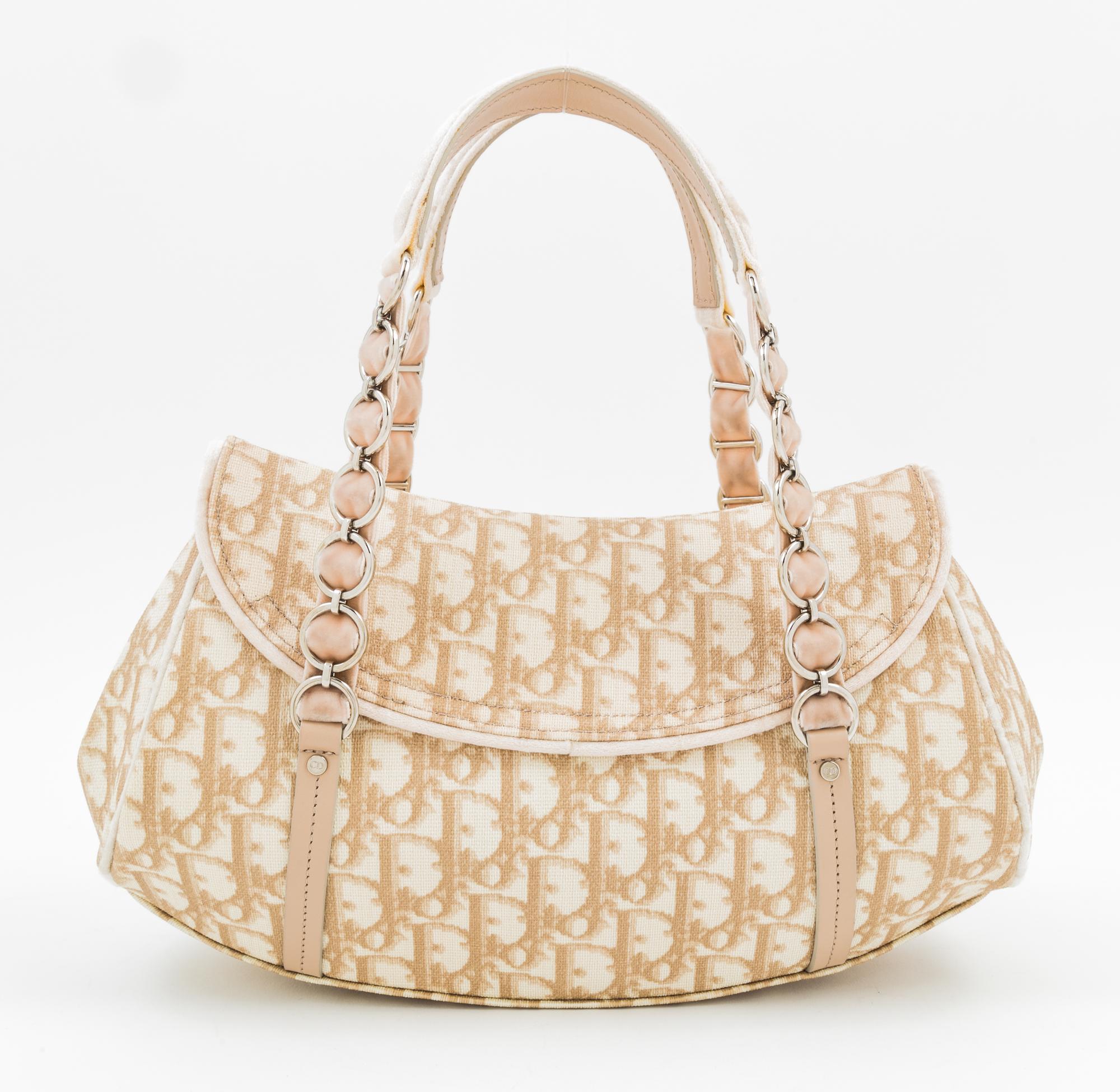 A Christian Dior Monogram Romantique Trotter Bag, 12" x 7" x 4"; Handle drop: 6".