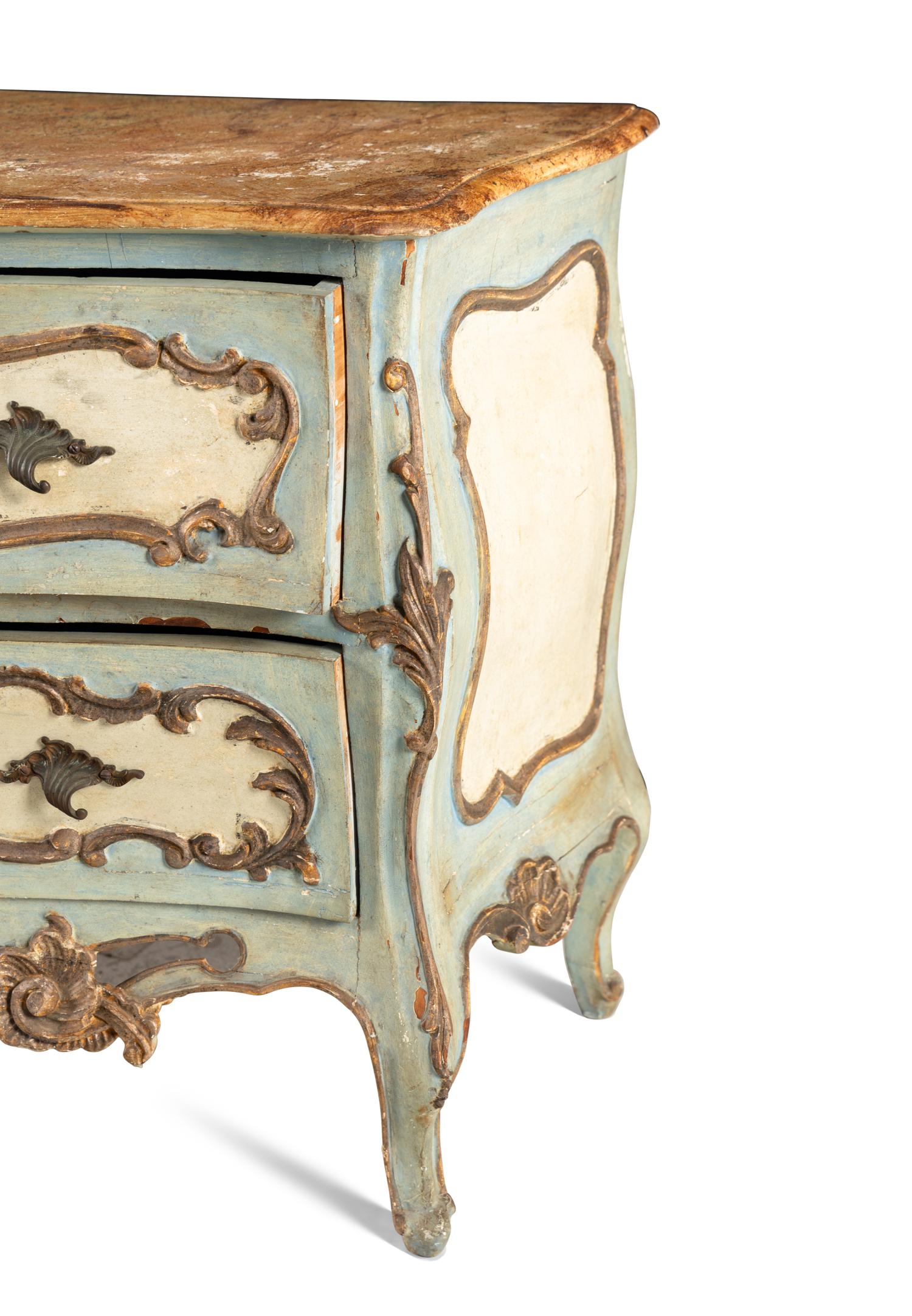 A Venetian Painted and Parcel Gilt Commode