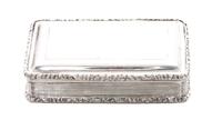 A Victorian Silver Snuff Box, Nathaniel Mills, Sheffield, Mid-19th Century, rectangular form with applied foliate borders and an engine