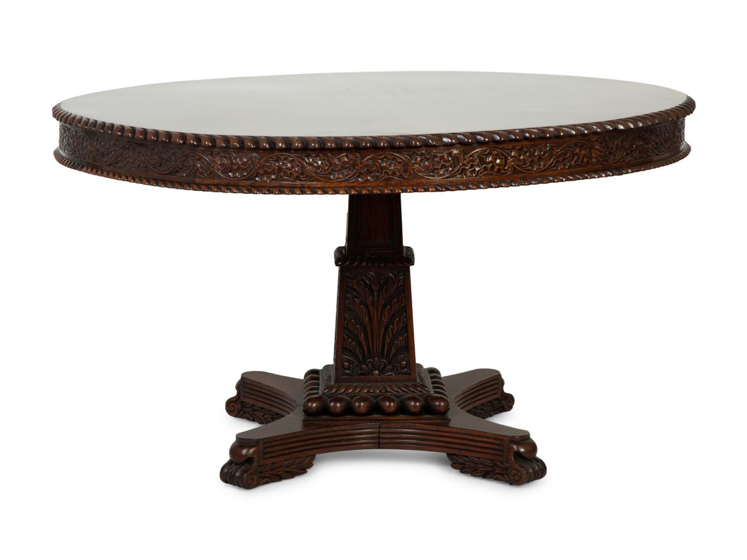 An Anglo-Indian Carved Padouk Wood Tilt Top Center Table — 19TH CENTURY