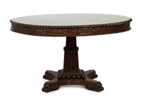 An Anglo-Indian Carved Padouk Wood Tilt Top Center Table — 19TH CENTURY
