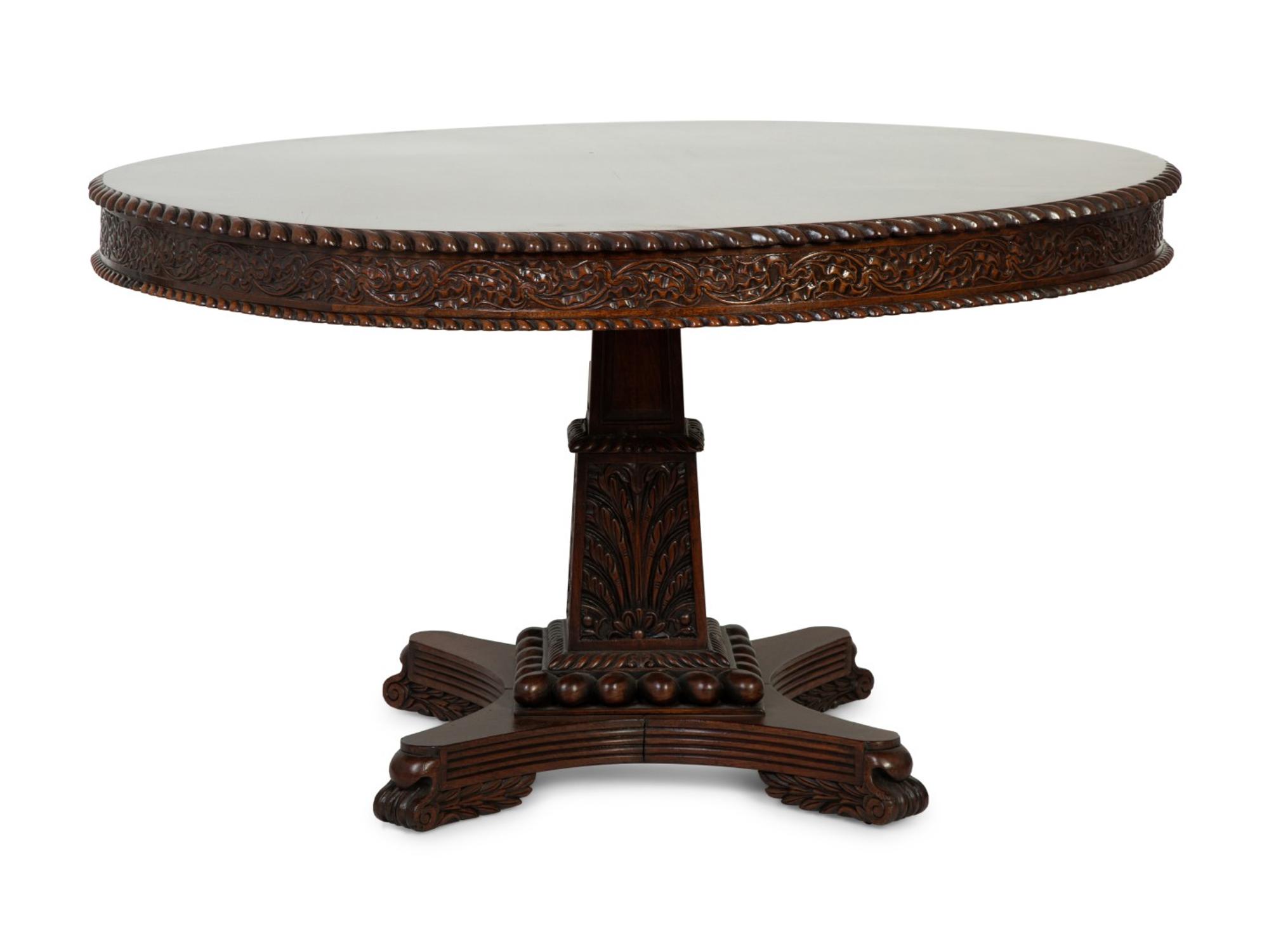 An Anglo-Indian Carved Padouk Wood Tilt Top Center Table — 19TH CENTURY