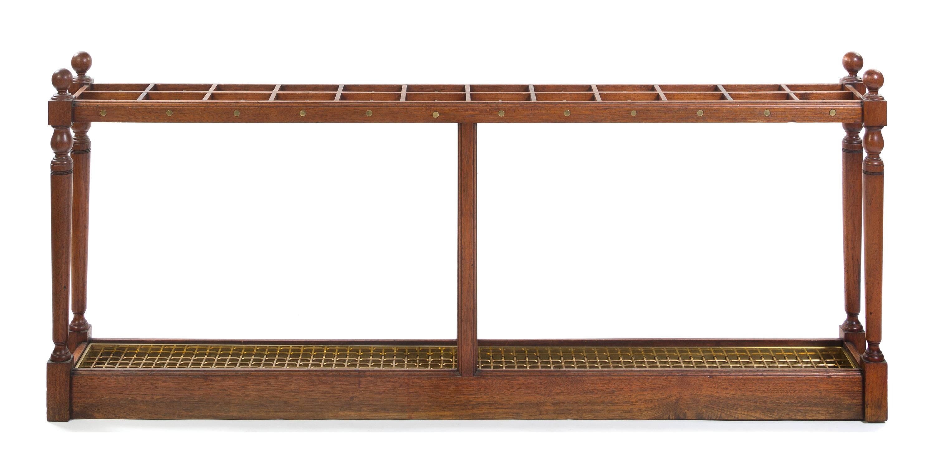 A Cherry and Brass Mounted Cane Stand, Height 28 1/2 x width 68 x depth 8 1/2 inches.