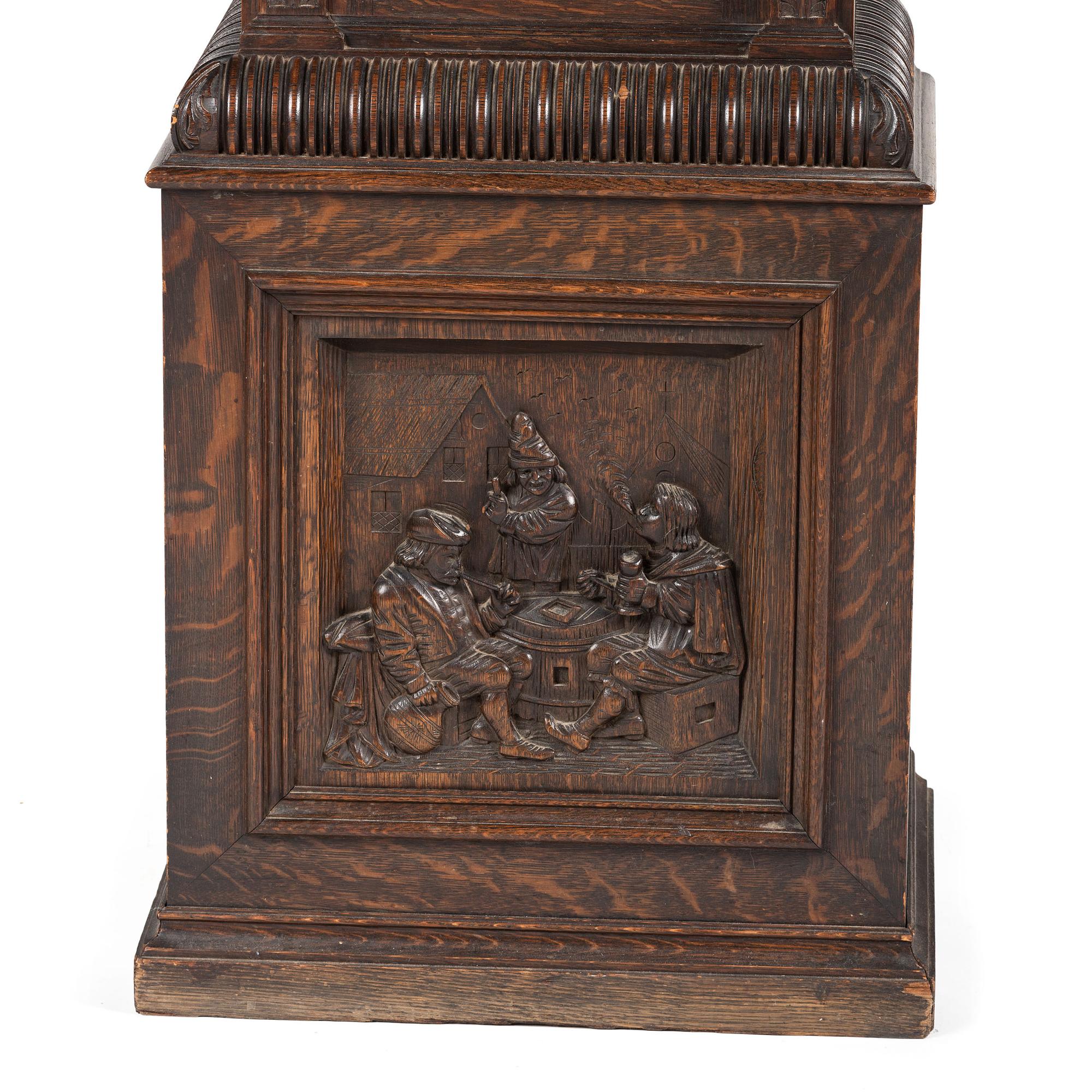 A Renaissance Revival Carved Oak Tall Case Clock