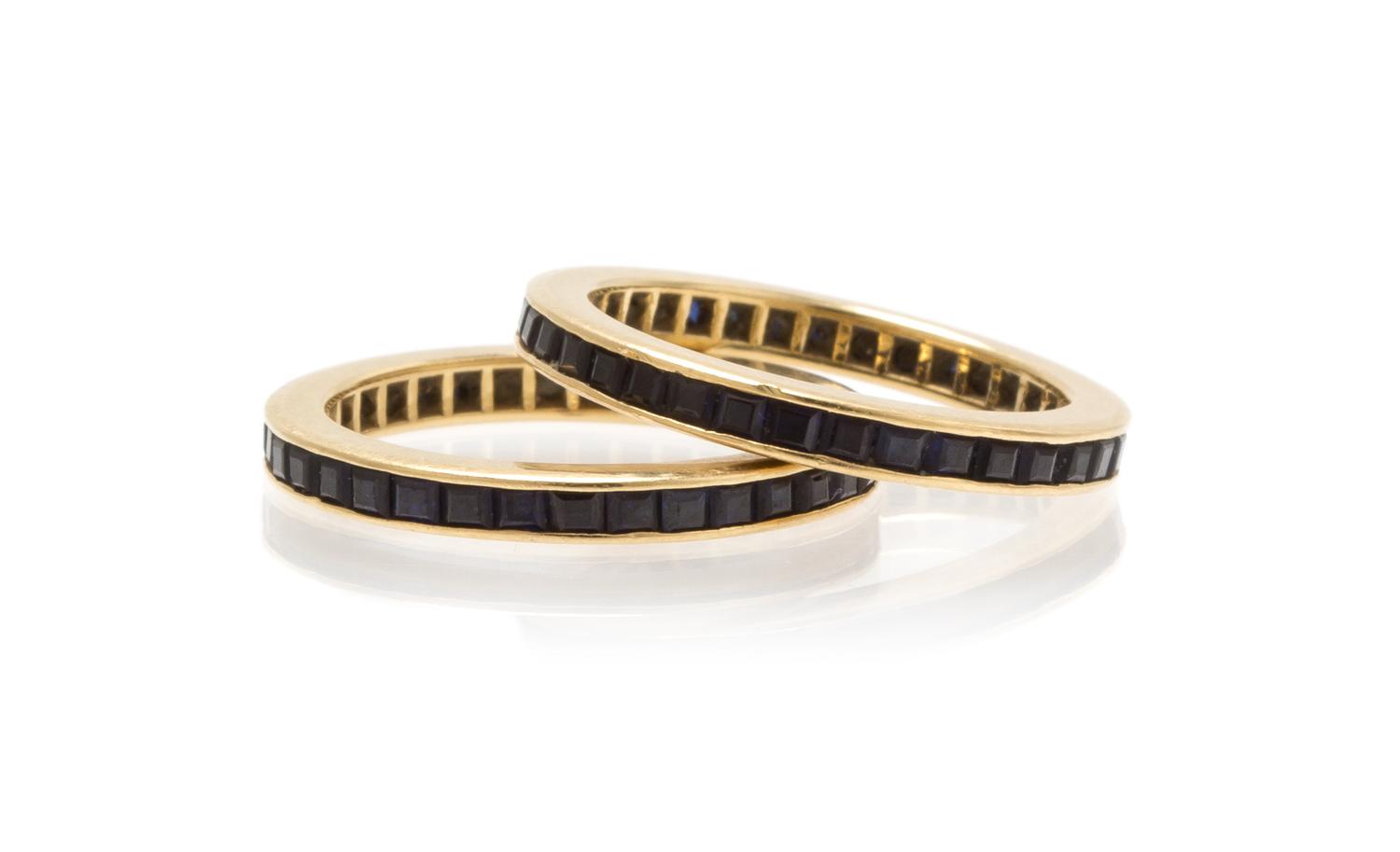 A Pair of Yellow Gold and Sapphire Eternity Bands, 3.20 dwts.