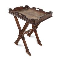 An Italian Carved Oak Butler's Tray and Stand
