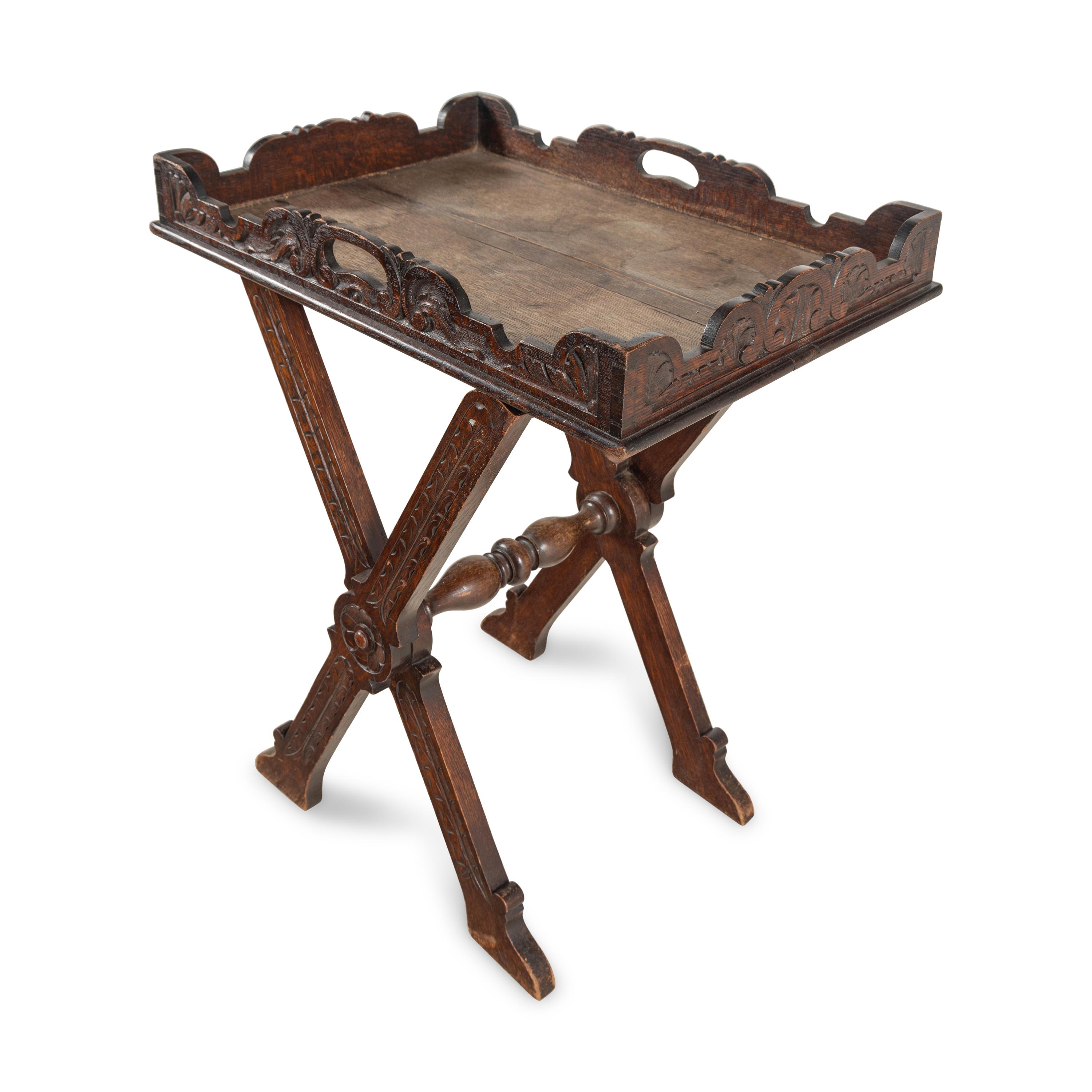 An Italian Carved Oak Butler's Tray and Stand