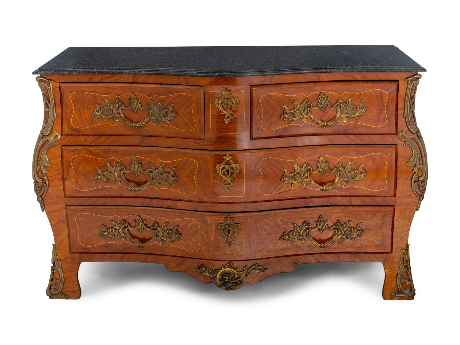 A Régence Style Gilt Metal Mounted Marble-Top Commode