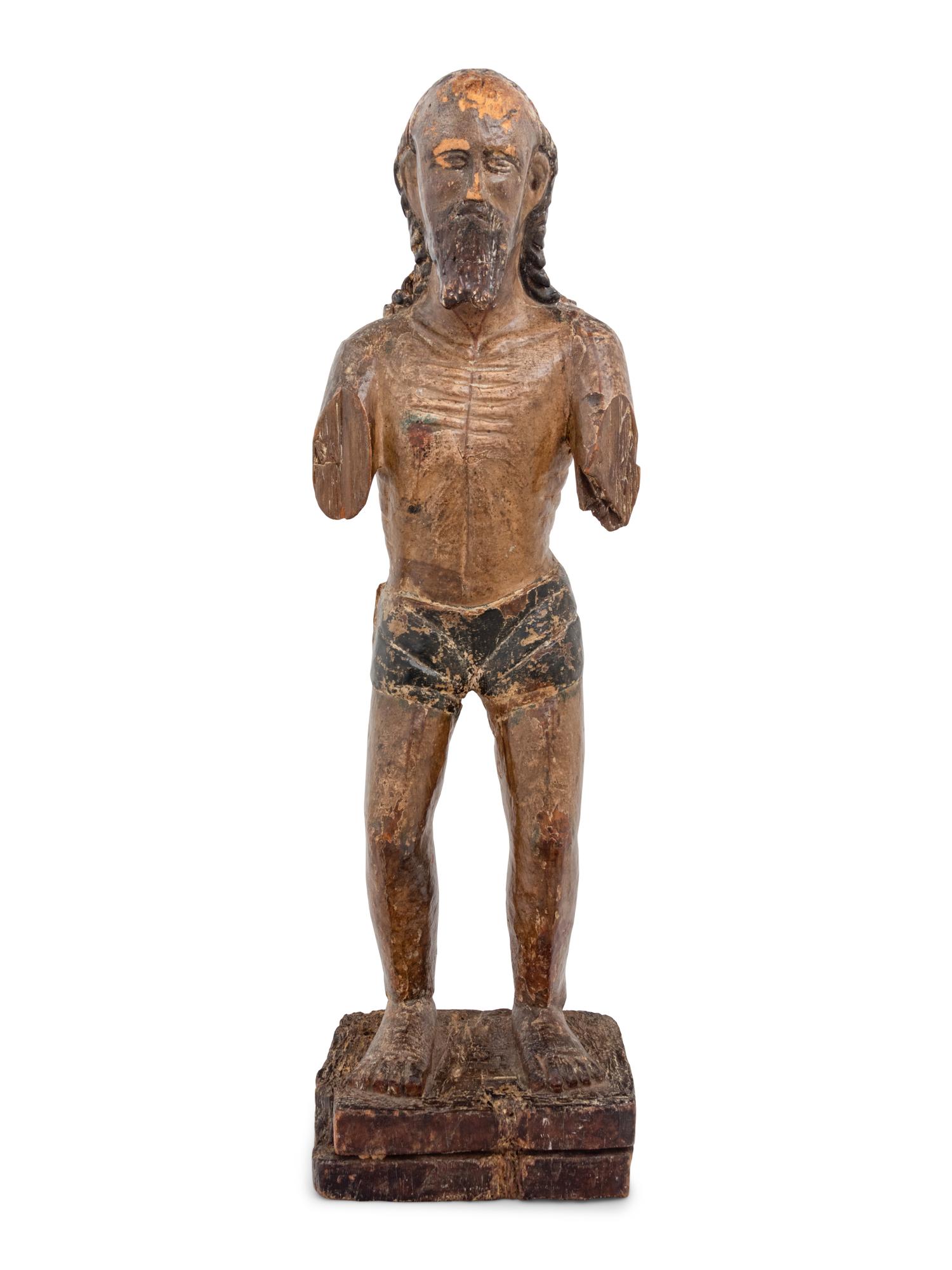 A Colonial Carved and Polychromed Figure of Christ