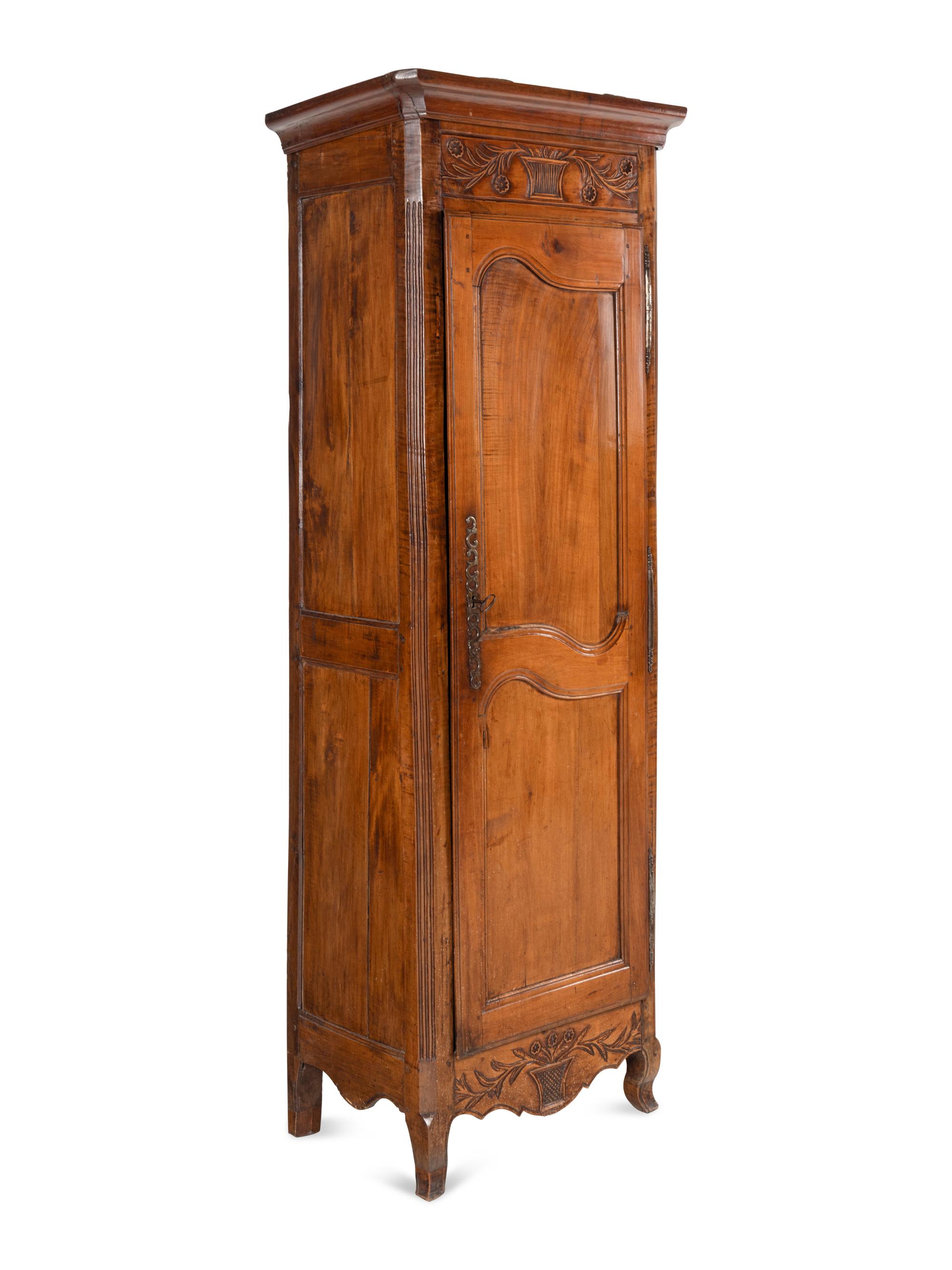 A Louis XV Provincial Walnut Cabinet