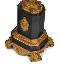 A Napoleon III Gilt Bronze and Slate Clock Garniture