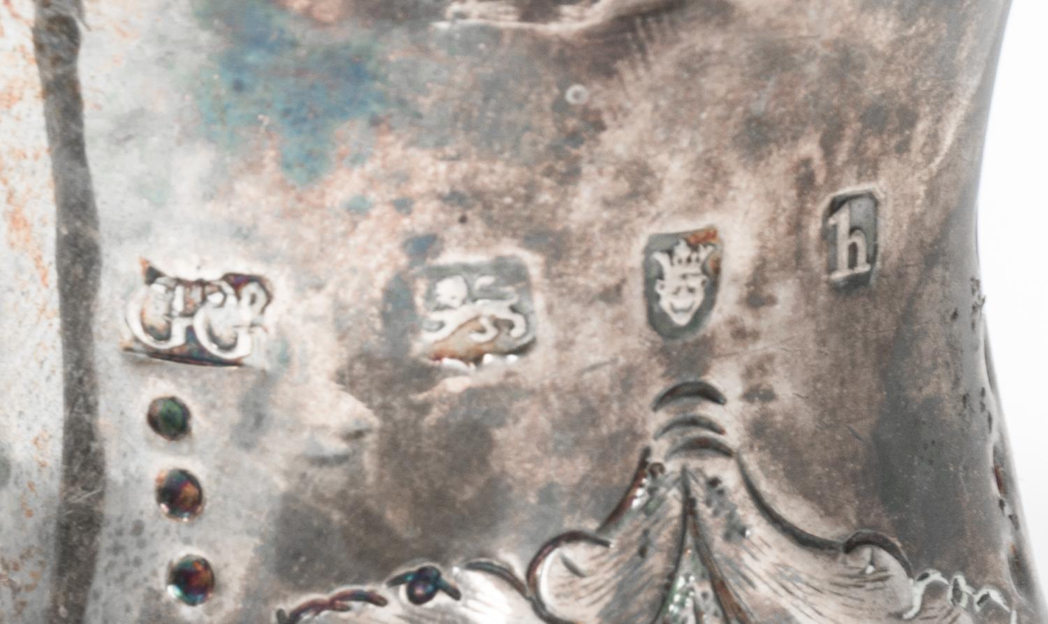 A George III Silver Creamer, George Gray, London, 1783, having hammered floral and foliate decoration.